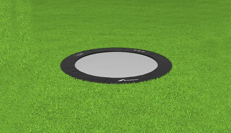 12ft Round Akrobat Primus Flat In-Ground Trampoline - Black (Black Pad with Grey Jump Mat) 1 akrobat black round inground trampoline on grass, Flat In-Ground Trampoline,