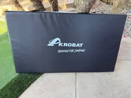 AkrobatUSA Landing Mat 10 A sleek kroba golf bag cover designed to protect and enhance the appearance of golf equipment during transport.