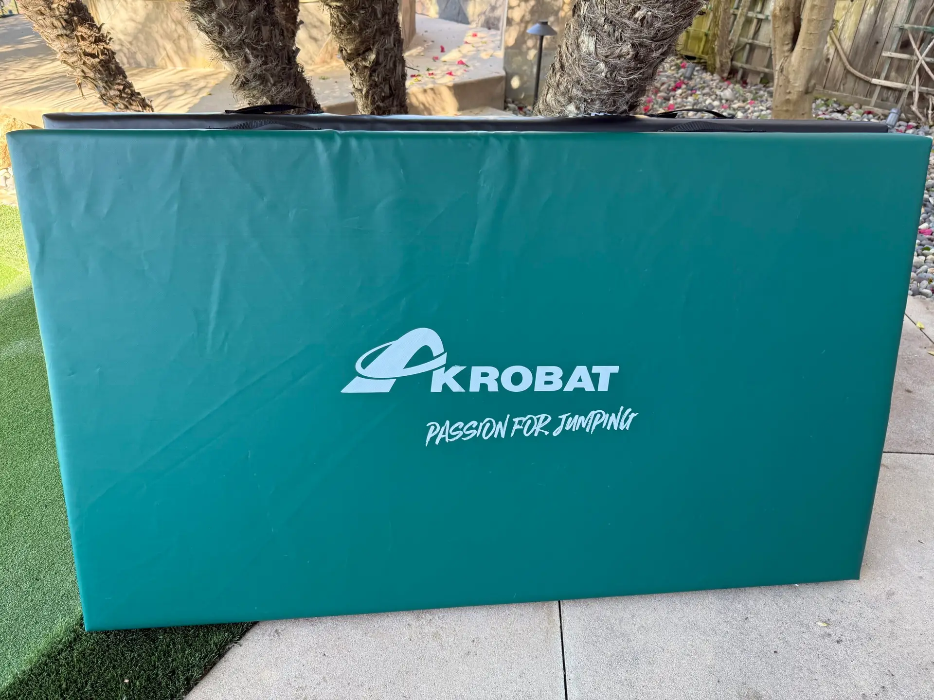 AkrobatUSA Landing Mat 4 A repetitive pattern of the word kobat displayed multiple times in a visually striking arrangement.