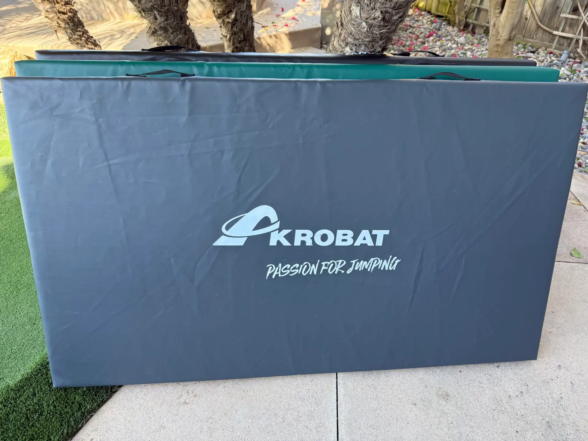 AkrobatUSA Landing Mat 5 A repetitive pattern of the word kobat displayed multiple times in a visually striking arrangement.