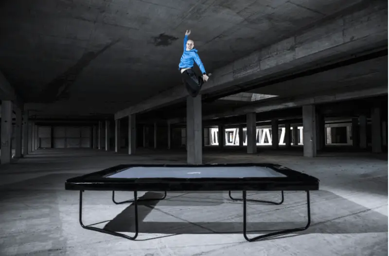 How Long Does a Trampoline Last? (+ What Impacts Its Lifespan) 4 athlete jumping on medium rectangular trampoline