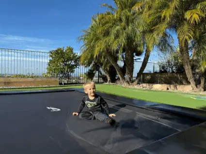 12.5ft x 8ft Akrobat Primus Flat Special Edition Black on Black In-Ground Trampoline 3 Sensory Processing Benefits